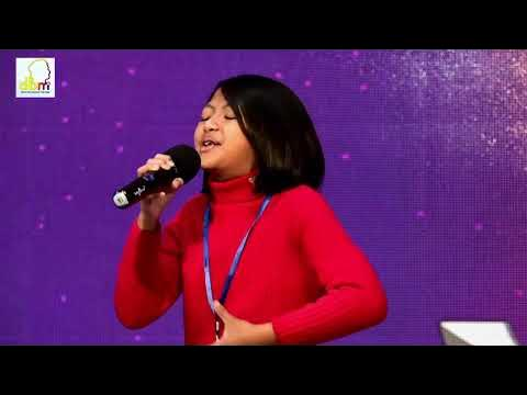 Young contestant singing on stage